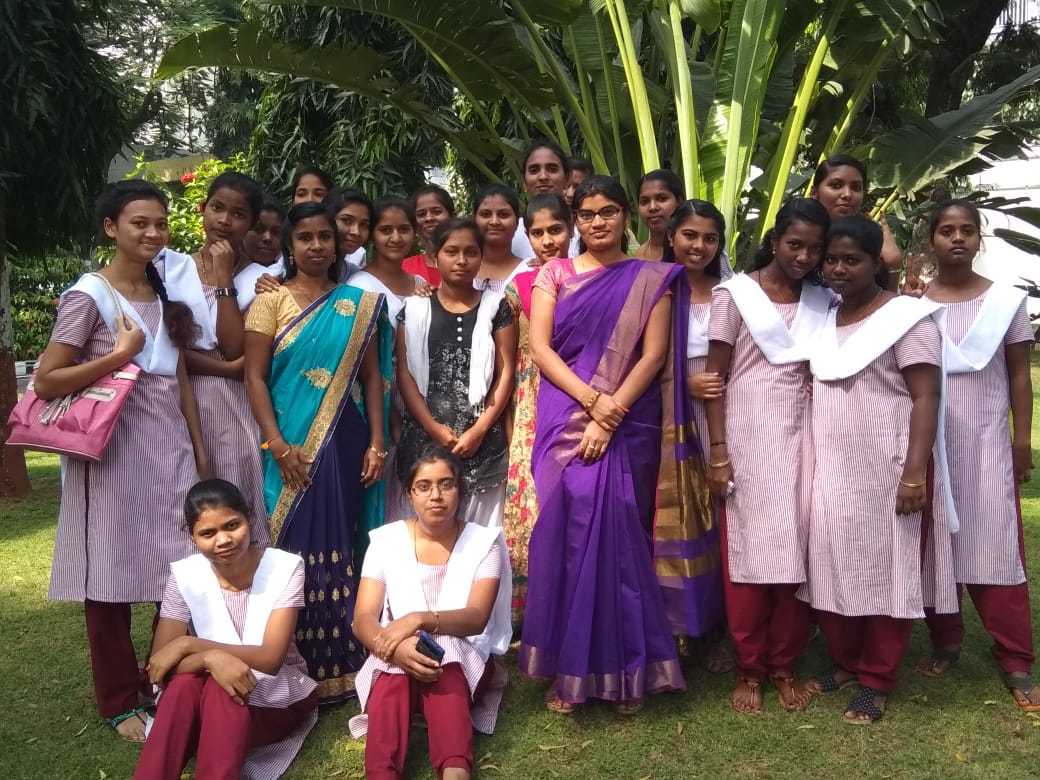 Students with faculty campus garden